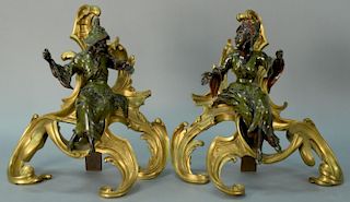 Pair of Louis XV style gilt bronze chenets, each mounted with seated Chinese figures, man and woman, each figure with green p
