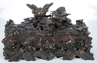 Victorian black forest box mounted with two birds and having all over foliate carving. ht. 9in., wd. 15in. Provenance: Proper