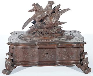 Black forest carved box topped with two game birds, set on scrolled feet. ht. 9in., lg. 12in., dp. 7 1/2in. Provenance: Prope