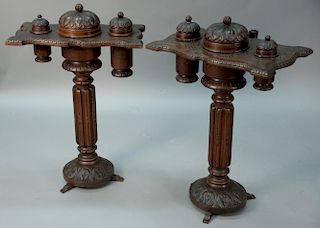 Pair of black forest tobacco cigar stands, three each with three covered containers, two of the three containers are removabl