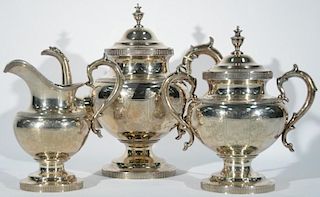 Tiffany & Co. three piece sterling tea set with teapot, sugar, and creamer, all with scroll handles, marked Tiffany & Co. 550