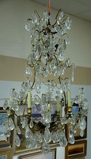 Rock crystal and crystal Louis XV style ormolu chandelier, electrified six arm light with total of fifteen lights, one arm in