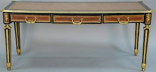 Gilt metal mounted and ebonized bureau plat, rectangular top with tooled leather inset writing surface above three drawers on