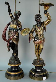 Pair of Venetian carved blackamoor figures holding small argente trays, polychromed and parcel gilt decorated wearing Orienta