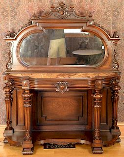 Walnut etagere having carved and mirrored back over inset marble on base with carved columns over shelf with carved feet. ht.