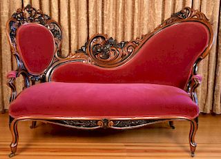 Rococo walnut settee having pierced carved back and overall ebonize decorated. 
ht. 44in., wd. 66 1/2in., dp. 28in. Provenanc