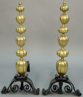 Pair of Italian Rococo brass figural andirons having squash form brass with top finial being in the form of four heads, all o
