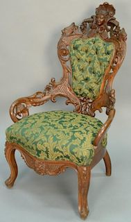 Victorian oak gentlemans chair with pierced carved back and arms mounted with ladies face flanked by winged figures, bird's h