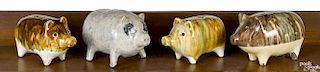Four pottery pig banks, early 20th c.