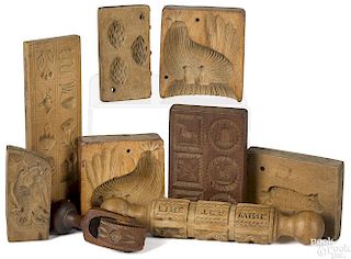 Nine carved food molds and stamps