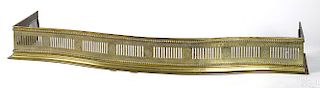 English brass serpentine fire fender, 19th c.