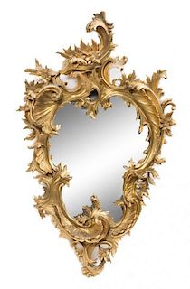 * A Rococo Style Giltwood Mirror Height 32 1/2 x width 19 3/4 inches.