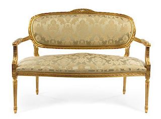 A Louis XVI Style Giltwood Settee Height 38 1/2 x width 48 inches.