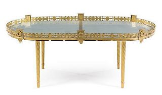 An Empire Style Gilt Metal Low Table Height 17 7/8 x width 44 3/4 x depth 24 3/4 inches.