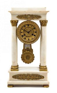 * A Charles X Marble and Gilt Metal Portico Clock Height 17 1/2 inches.