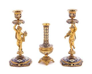 * A Pair of Champleve Decorated Gilt Bronze Figural Candlesticks Height of candlestick 8 inches.
