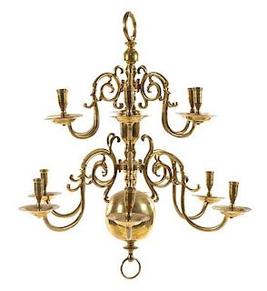 A Dutch Baroque Style Brass Twelve-Light Chandelier Height 27 1/2 x diameter 26 inches.