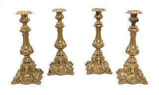 A Set of Four Baroque Style Gilt Metal Candlesticks Height 15 1/2 inches.