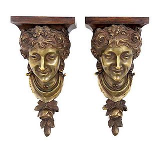 * A Pair of Continental Bronze Wall Brackets Height 12 inches.