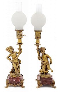 A Pair of Continental Gilt Metal Figural Lamps Height overall 27 inches.