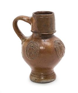 A German Stoneware Drinking Jug Height 7 inches.