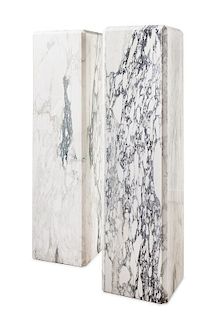 A Pair of Marble Pedestals Height 54 1/2 inches.