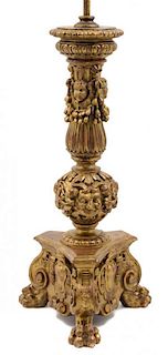 An Italian Carved Giltwood Pricket Height overall 35 5/8 inches.