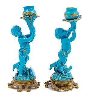A Pair of Continental Bronze Mounted Porcelain Figural Candlesticks Height overall 9 3/4 inches.