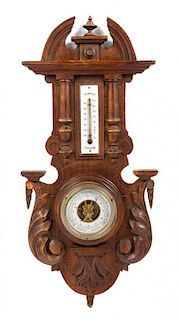 A Continental Carved Oak Barometer Height 24 inches.