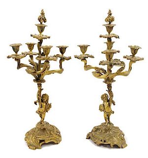 * A Pair of Gilt Bronze Figural Five-Light Candelabra Height 22 1/2 inches.