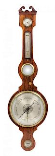 An English Rosewood Wheel Barometer Height 42 1/2 inches.