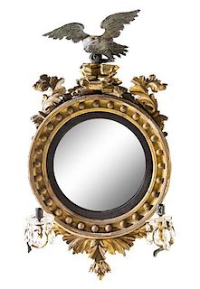 * A Regency Parcel Ebonized Giltwood Bullseye Mirror Height 37 x width 25 inches.