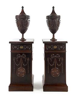 A Pair of Chippendale Style Mahogany Urn Cabinets Height 65 x width 18 1/4 x depth 18 1/4 inches.