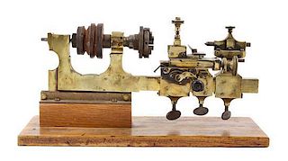 A Continental Brass Watchmaker's Lathe Width of lathe 16 inches.