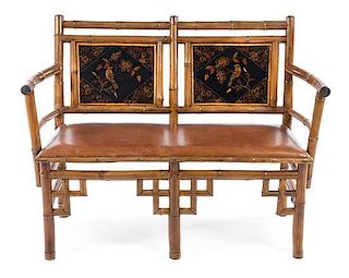 An English Lacquered Bamboo Settee Height 37 inches.
