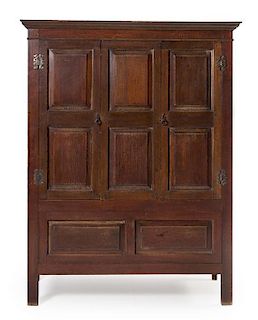 An English Oak Livery Chest Height 72 7/8 x width 56 1/4 x depth 20 3/4 inches.
