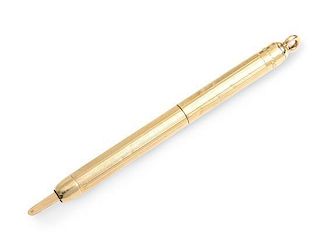 * An American 14-Karat Yellow Gold Retractable Toothpick, Tiffany & Co. New York, NY, the engine-turned body twisting to reve