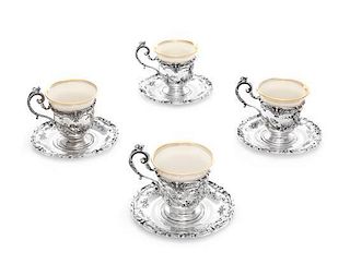A Set of Twelve American Silver Coffee Cups and Saucers, Reed & Barton, Taunton, MA, each with Lenox porcelain liners.