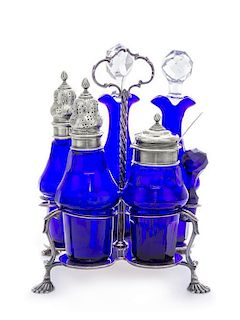 A Danish Silver and Cut Glass Cruet Set, Anton Michelsen, Copenhagen, 1915, the fitted carrier with two silver-mounted cobalt