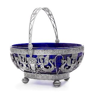 A French Silver Center Bowl, Apparently Unmarked, having a swivel handle worked to show serpent, mask and floral motifs above