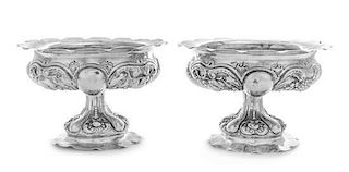 A Pair of German Silver Compotes, 19th Century, each having a scalloped rim and a lobed body worked to show repousse berry an