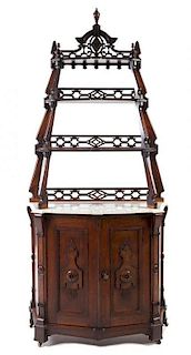 A Victorian Walnut Etagere Height 79 1/2 x width 35 1/2 x depth 15 3/4 inches.