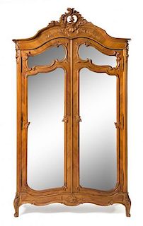 A Victorian Style Walnut Armoire Height 80 x width 36 x depth 16 inches.
