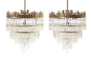 A Pair of American Neoclassical Bronze Chandeliers Height 41 1/2 x diameter 18 inches.