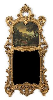 An Italian Baroque Style Carved Giltwood Trumeau Mirror Height 61 x width 21 1/2 inches.