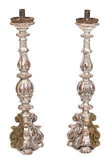 A Pair of Italian Carved Silver Giltwood Torcheres Height 23 3/4 inches.