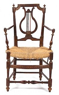 A French Provincial Carved Walnut Fauteuil Height 33 inches.