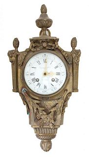 A Louis XVI Style Gilt Metal Cartel Clock Height 16 x width 7 x depth 3 inches.