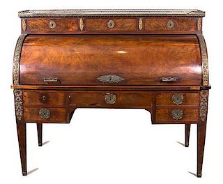 A French Empire Style Gilt Bronze Mounted Bureau A Cylindre Height 49 x width 55 1/2 x depth 27 1/2 inches.