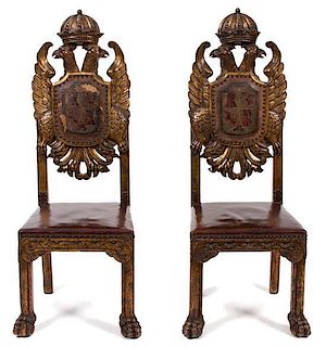 A Pair of Central European Parcel Gilt and Leather-Upholstered Carved Hall Chairs Height 50 1/2 inches.